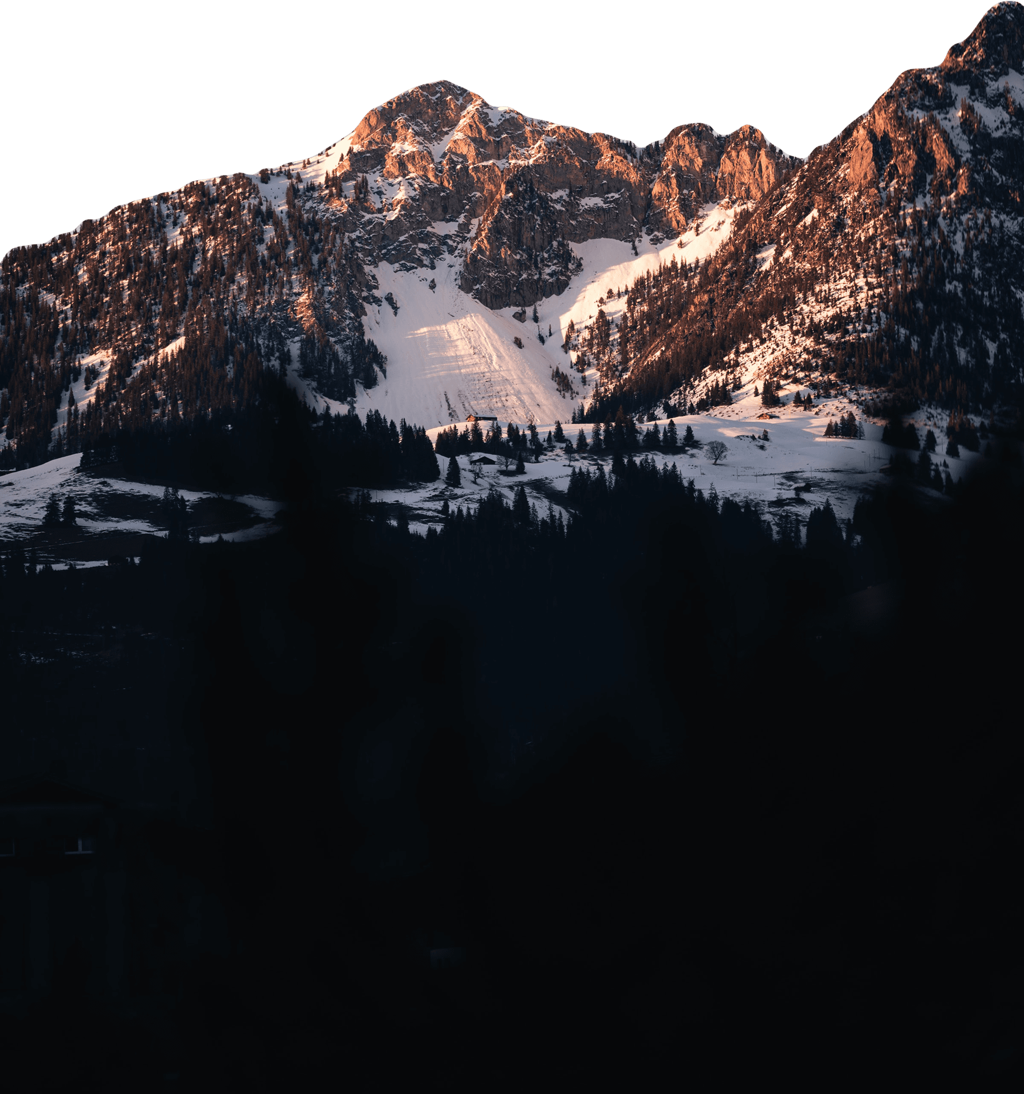 Snow-capped mountain peaks at golden hour